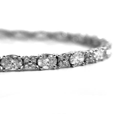 18K White Gold 7inch Alternating Cluster Tennis Bracelet w/26 Oval Diams=3.69ctw and 104 Round Diams=.80ctw SI H-I #B11-163240